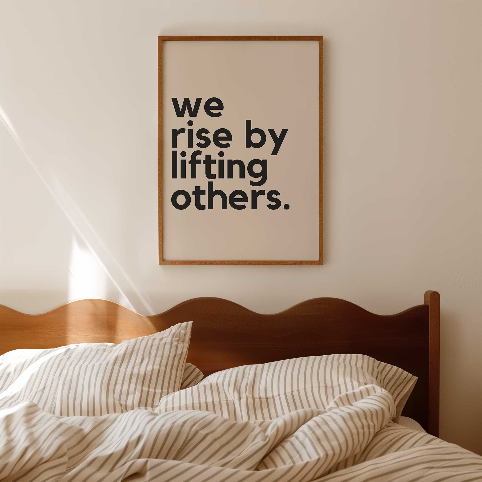 We Rise by Lifting Others' empowering typography, framed wall art print for a kindness aesthetic, titled 'We Rise by Lifting Others'