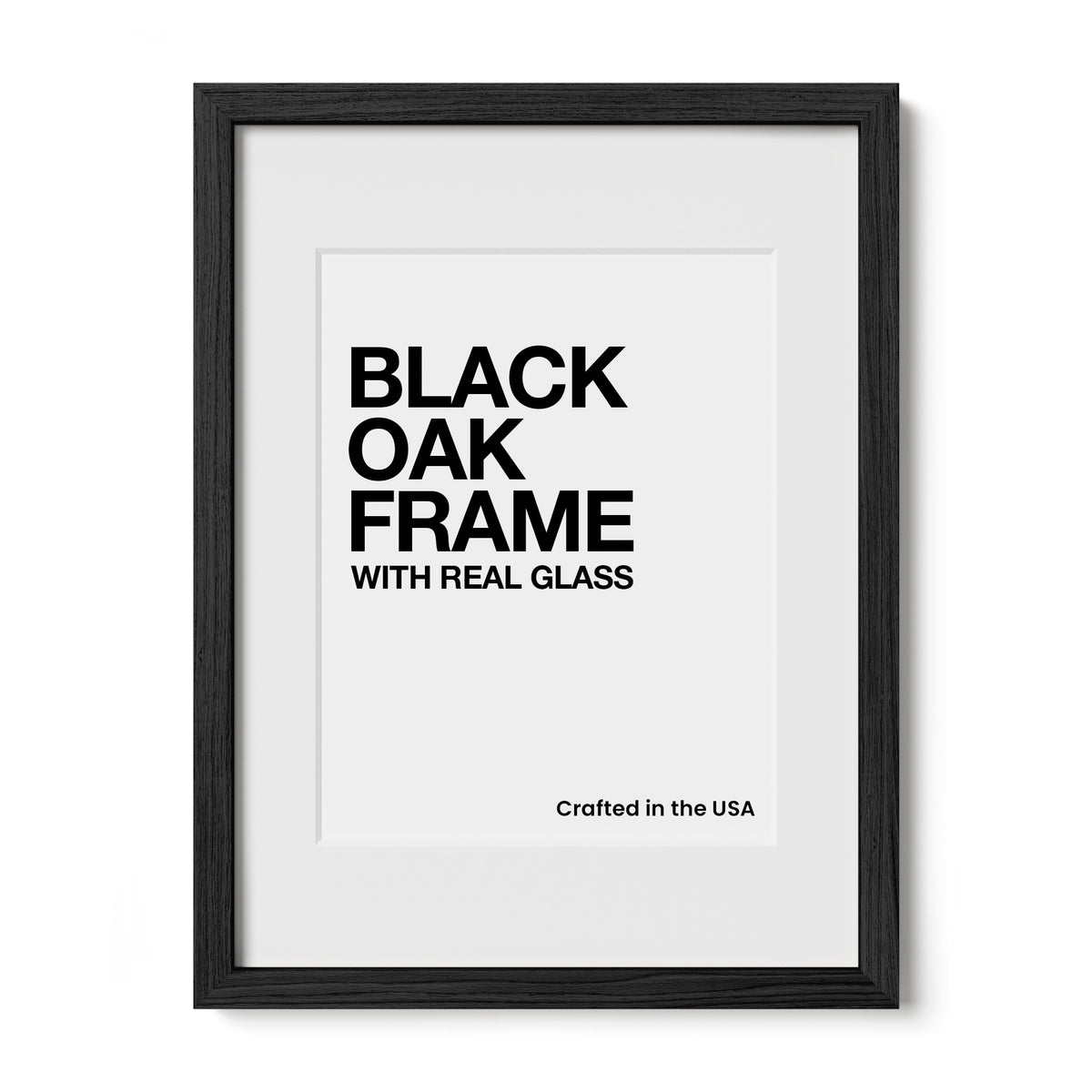The image is a framed print with the text "BLACK OAK FRAME WITH REAL GLASS" in a black and white design.